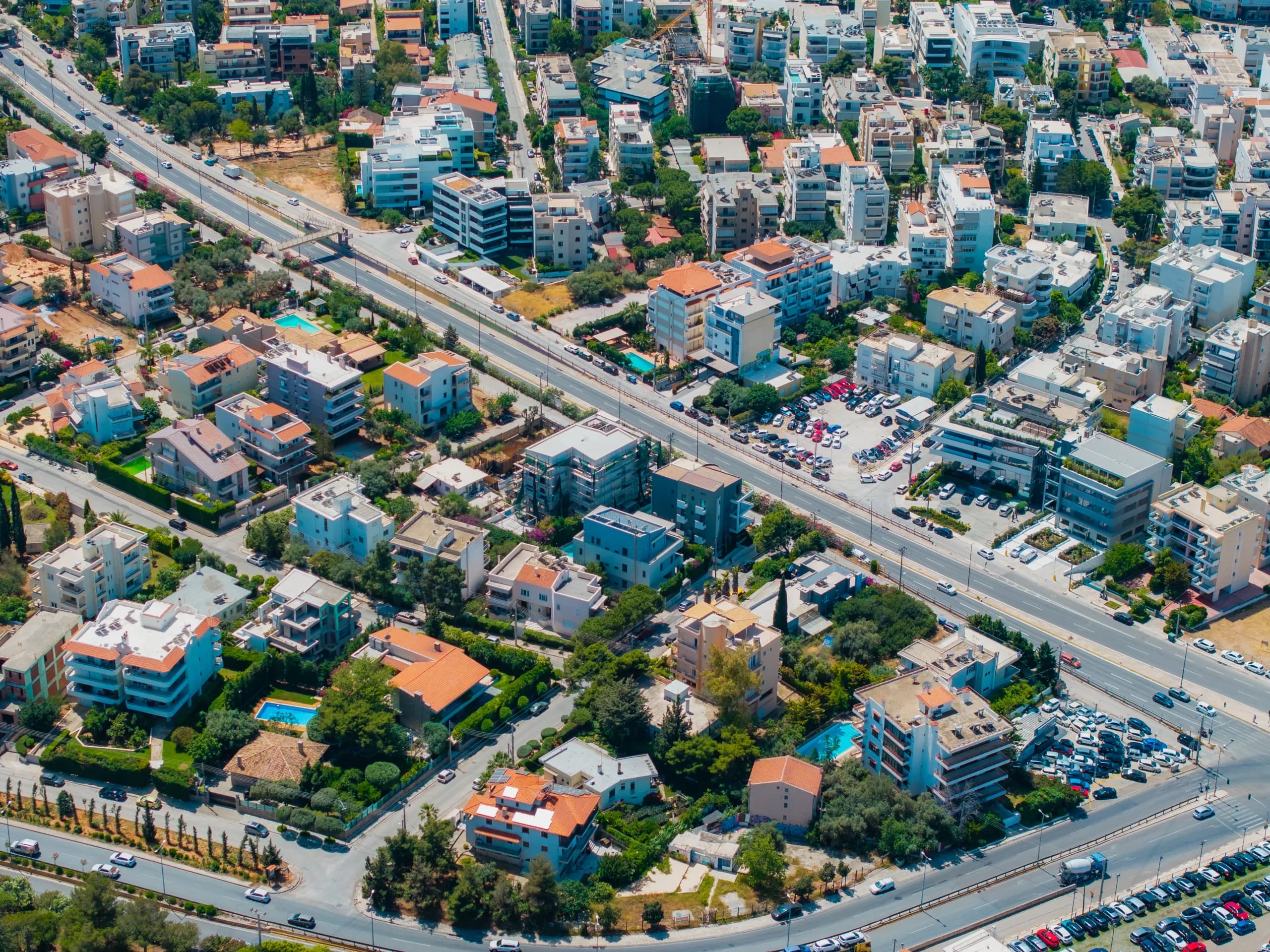 Aerial view of a dense Athens neighbourhood along a main avenue