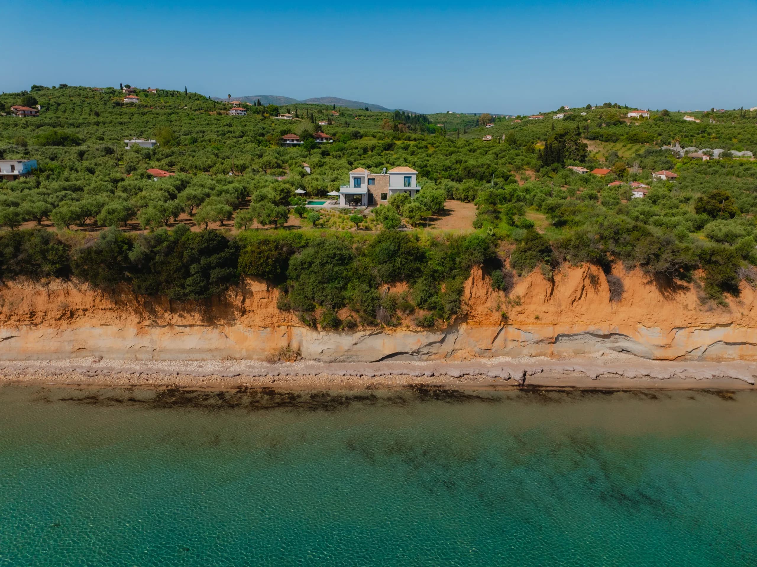 Rocky coastline with clear shallow turquoise water