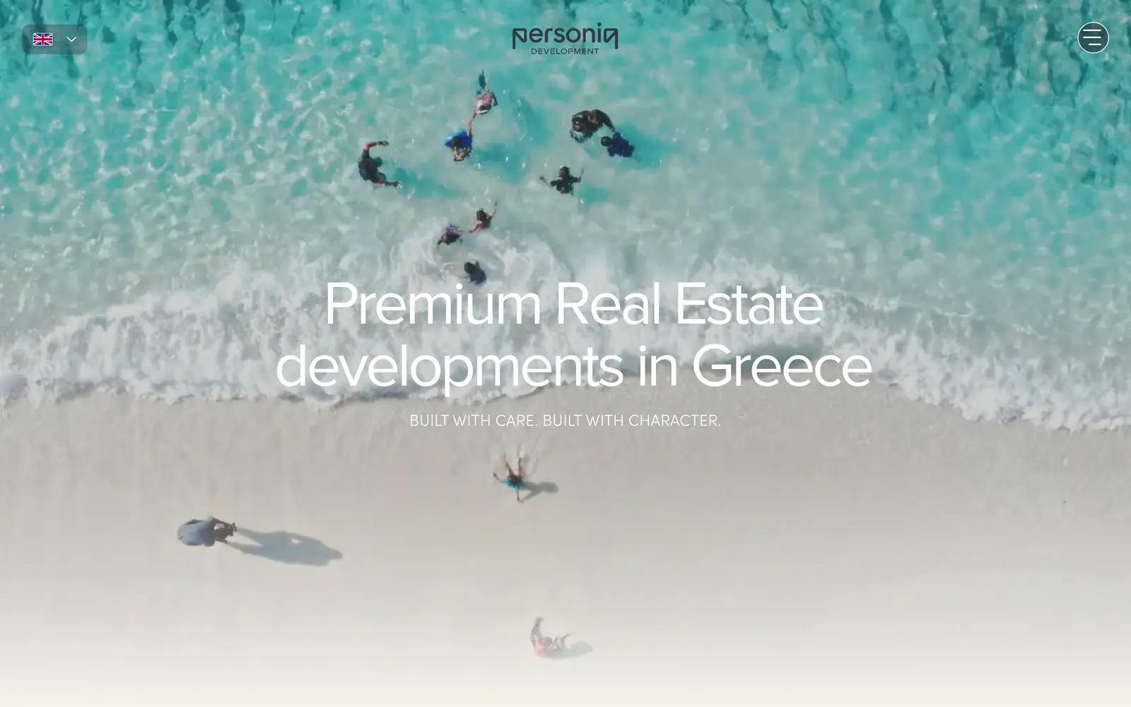 The PersonIQ Development homepage, an aerial shot of a Greek beach behind the headline